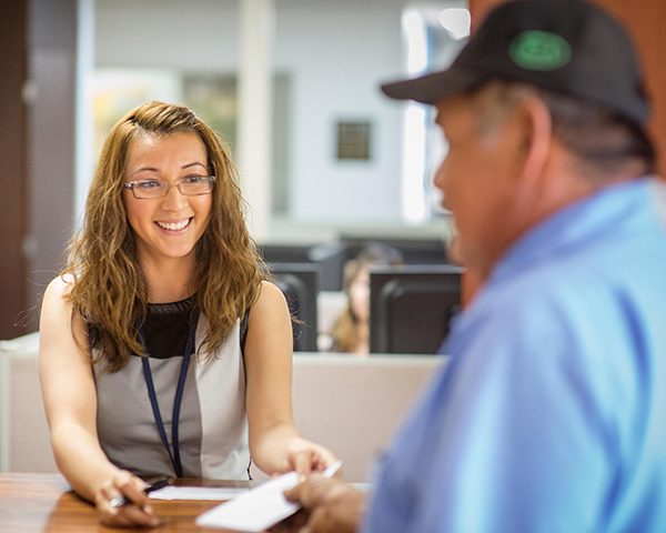 Customer Paying Bill at the Customer Service Desk